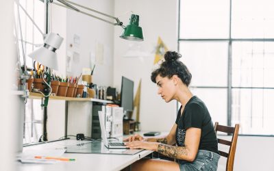 Artist freelancer at desk with laptop