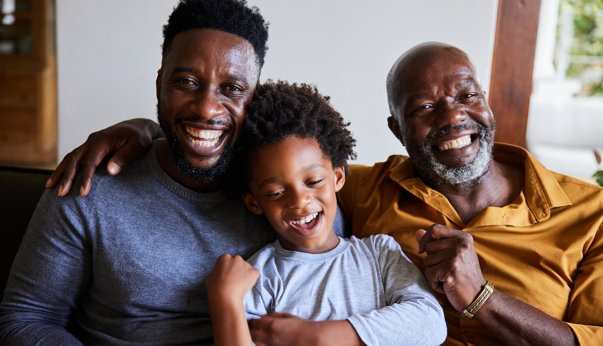 Black family with three generations of grandfather, son and grandson together